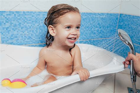 My baby inhaled water while bathing today and got breathless for few seconds and constantly taking out her tongue but now she is absolutely fine. Beautiful little girl taking a bath | High-Quality People ...