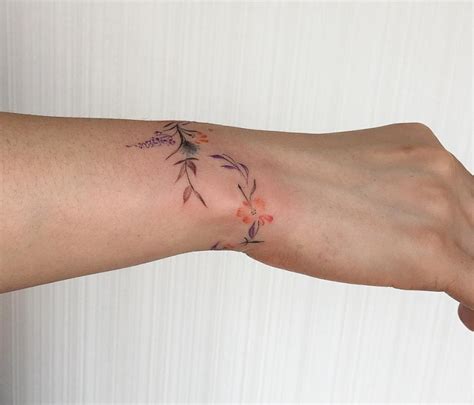 Red and pink flower tattoo on right wrist. 77 Deliciously Delicate Wrist Tattoos - Page 2 of 8 ...