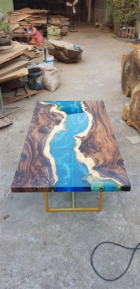 The tiger reference evolved from the markings in the wood grain that weren't initially apparent, but became obvious after the resin work, much like a meaningful discussion becomes more s Blue river table top with epoxy inlay Senna siamea wood ...