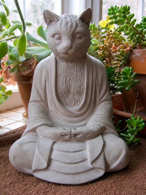 Statues and figurines will bring the story element in your garden. why not? | Garden deco, Cat buddha, Cat statue