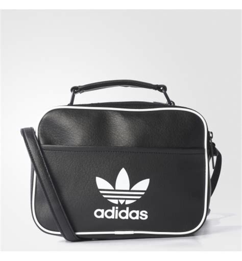 Update your basics with the mini adidas airliner bag, featuring a streamline design with adidas branding. Adidas Mini Airliner Bag