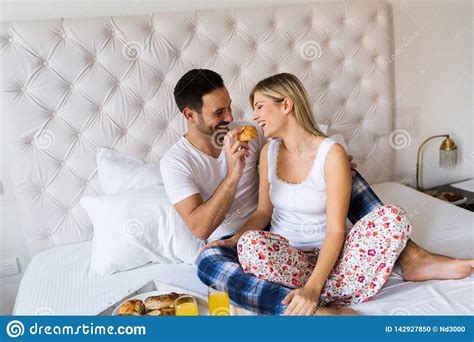 Young Couple Having Having Romantic Times In Bedroom Stock Photo - Image of adult, affectionate ...