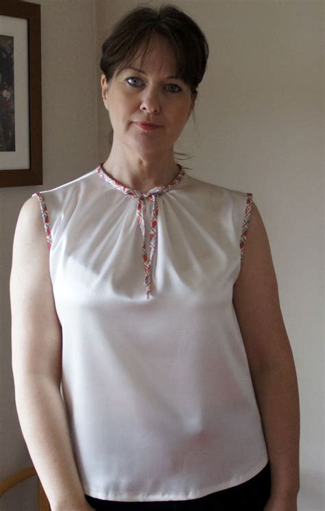 Woven blouse in a satin quality featuring shell button closures. White satin sleeveless blouse aa mm | Bow blouse, Blouse, Sleeveless blouse