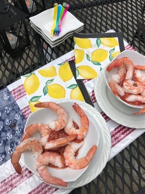 Pile shrimp, limes, and lemons on top of ice. Pretty Shrimp Cocktail Platter Ideas - Cream Cheese ...