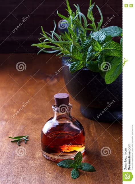 Maybe you would like to learn more about one of these? Mint And Rosemary Essential Oil Stock Photo - Image of ...