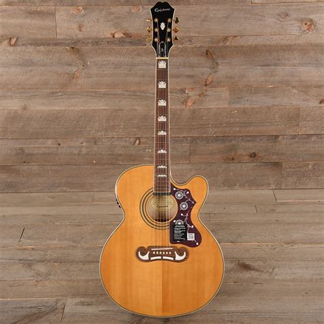For another $300 the anthem turns this into a $2000 guitar. Epiphone EJ-200SCE Solid Top Vintage Natural MINT | Reverb