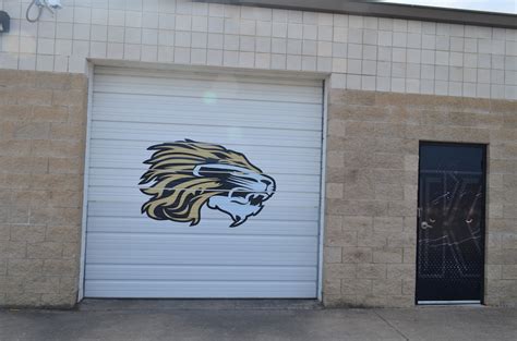 Forklifts, pallet jacks, and other. Field House Graphics for Kaufman Lions by Armour Wraps