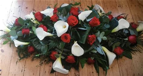 Explore trending updates, funeral home, sevices, obituary, coffin, bio, wiki, net worth. Funeral Flowers - Red Rose and Cala Lily Casket Spray