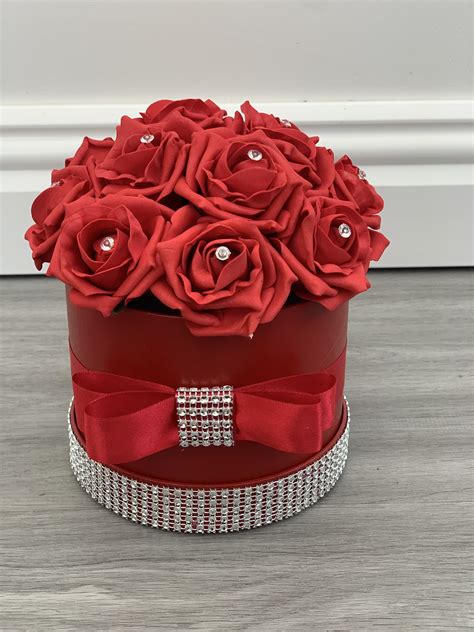 Bloom magic offer beautifully handcrafted flowers & floral arrangements. Artificial Flower Hat Box Red Diamante