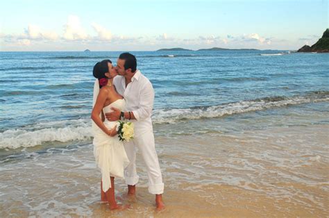 We think nothing says beach wedding like a simple sarong or sundress blowing in the breeze. View the complete wedding gallery