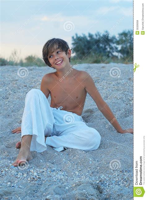 Vlad a beautiful ukrainian nudist boy star died too soon from a car accident. Happy boy on the beach stock photo. Image of coast, smiles ...