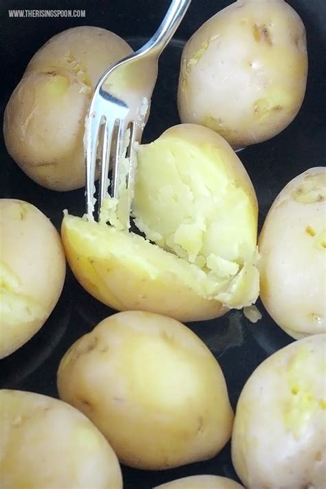 These crock pot mashed potatoes are diced russet potatoes that are simmered in the slow cooker, then mashed with butter and cream cheese for a decadent and delicious side dish. Crock-Pot "Baked" Potatoes | The Rising Spoon