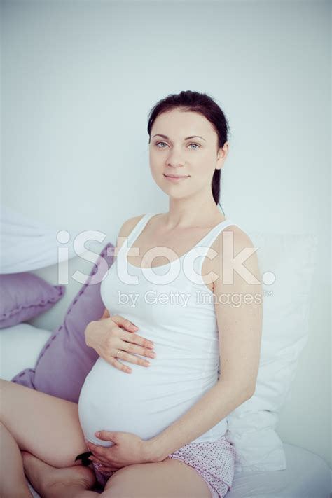 Maybe you would like to learn more about one of these? Young Pregnant Woman IN The Bedroom Stock Photos ...