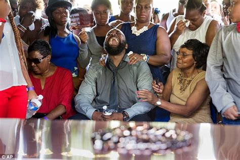 A general memorial fund has been established. Michael Brown's father Cal screams as thousands attend St ...