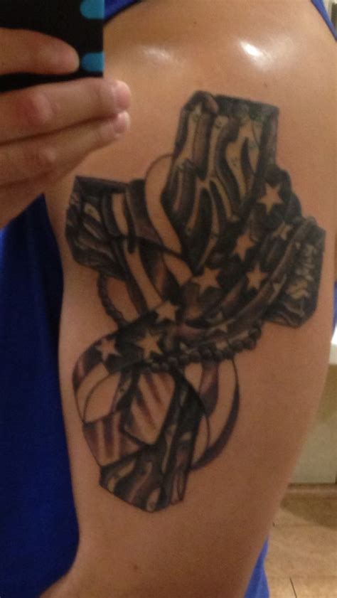 This is one of the most suggestive designs. Black military memorial cross and flag tattoo on arm ...