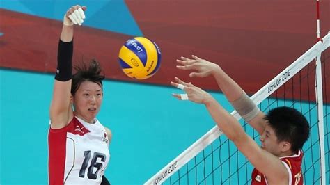 Each team tries to score points by grounding a ball on the other team's court under organized rules. Yukiko Ebata of Japan spikes the ball as Lei Zhang of ...