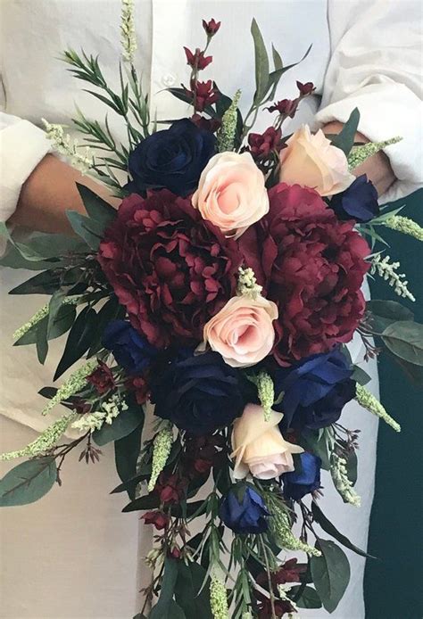 This eye catching cascade bouquet of lavender and purple hydrangea, white and hot pink tulips as well as blush pink roses was designed by sitting pretty and photographed by adene photography here. Cascading Navy Burgundy Blush Bridal Bouquet-Cascading ...