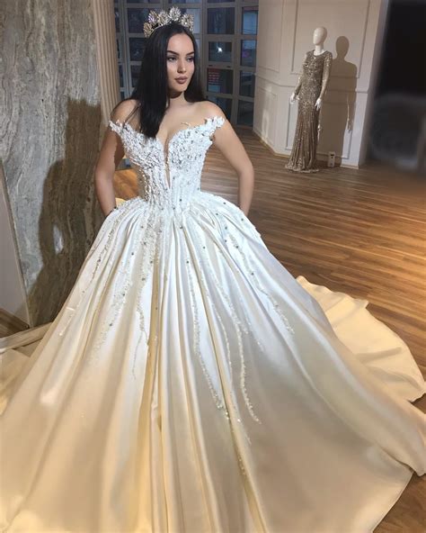 Wedding dresses with sleeves are so much more than just a style statement and the recent royal weddings have started a new fashion that we love! Sexy Luxurious Beaded Sequins Wedding Dresses Sheer Neck ...