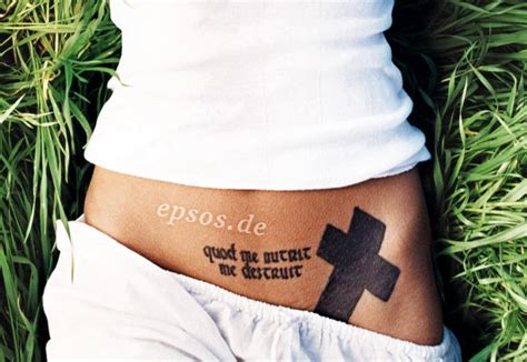 This tattoo at the base of her neck reads lower back tribal: Style Crumble: Tattoos - Part 1