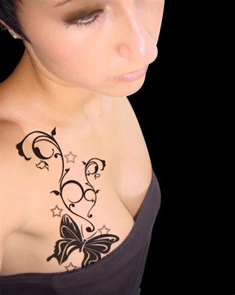 This colorful tattoo is all about giving you permanent body jewelry. Pin on breast tattoo