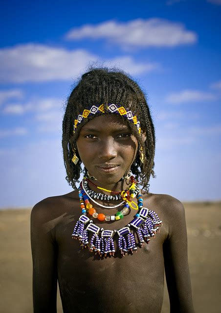 Afar is a different kind of travel magazine that guides and inspires those who travel the world i've been reading and enjoying afar ever since it launched almost a decade ago. Afar Tribe Girl With Big Necklace And Braided Hair ...
