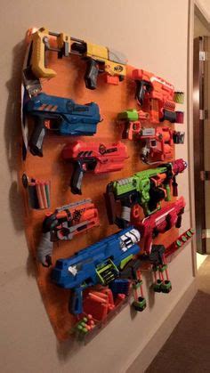 Make your own diy nerf gun camo peg board with led lights behind it! DIY Nerf gun rack- used a ladder from an old bunk bed ...