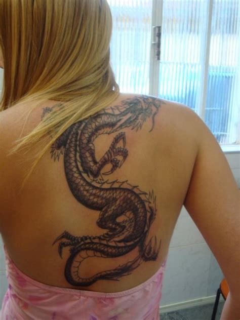 Dragon tattoo, along with some feminine designs like cherry blossom, blend well on a woman's body. Dragon Tattoos For Girls