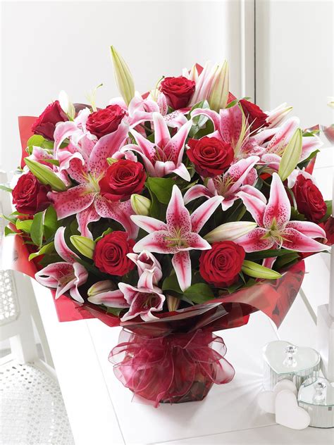 The reaper and the flowers: A mix of romantic red roses and sweet smelling Lillies ...