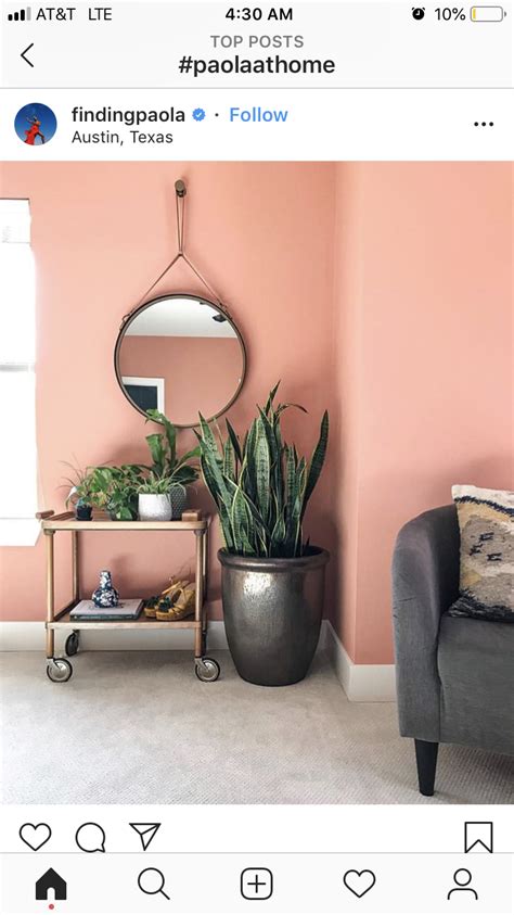 Cozy like a cup of coffee, a mocha accent wall allows this master bedroom to stand out. Salmon/pink wall color | Living room wall color, Pink ...