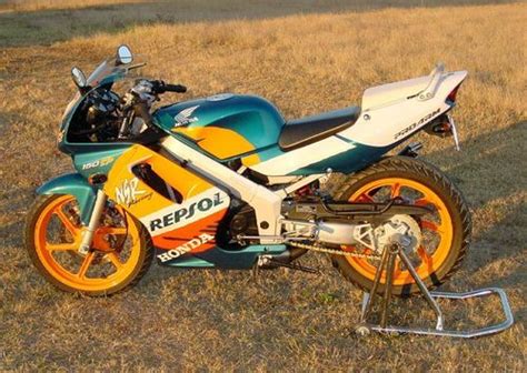 With their insignia colours of white, orange and red. Honda NSR150 - CycleChaos