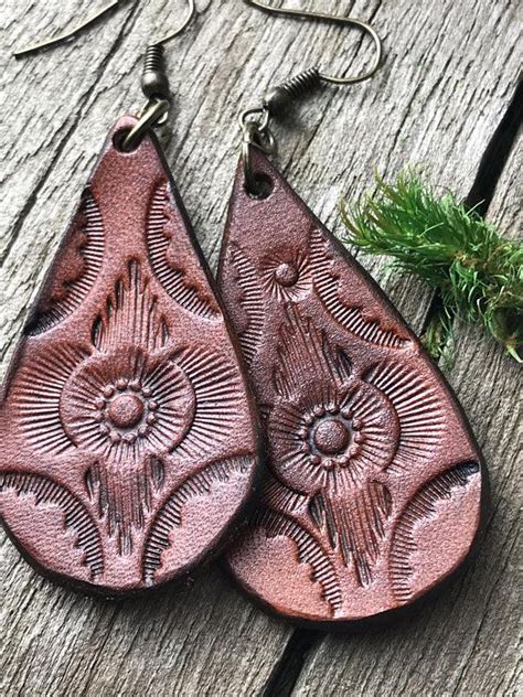 We would like to show you a description here but the site won't allow us. Hand Tooled Leather Earrings Floral Design Leather ...