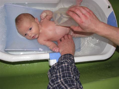 Line the tub or sink with a clean towel. LunaMama...: Splish, splash-- baby's first bath!