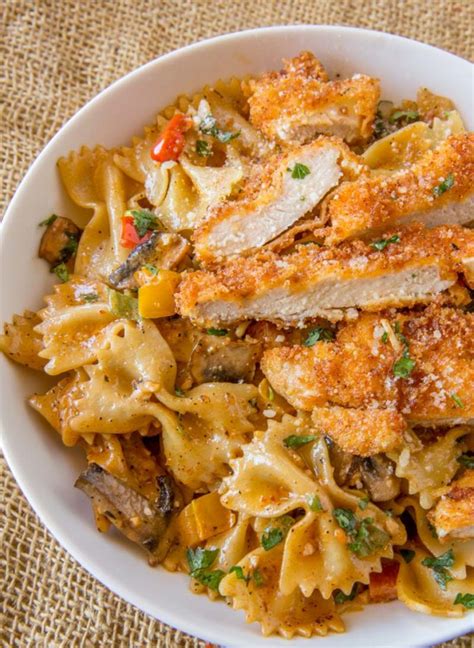 In a large, deep frying pan over medium low heat, put oil and garlic and saute to. Louisiana Chicken Pasta (Cheesecake Factory Copycat ...