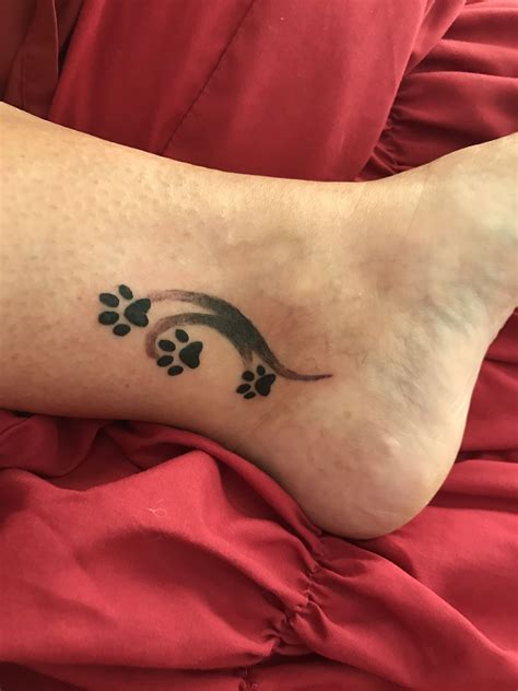 Heart shape in paw print tattoo on heel. Puppy paw tattoo for my 3 fur babies | Paw tattoo, Tattoos ...