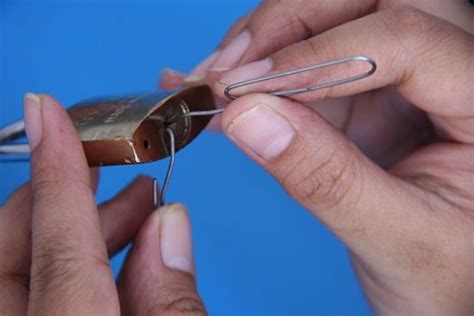 Twist your lock pick around until the lock opens. Pick a Lock Using a Paperclip | Hacks, Life hacks, Survival prepping