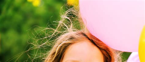 You do not need to give up wearing a hat and risk getting a cold. Why does rubbing a balloon on your hair make it stick?