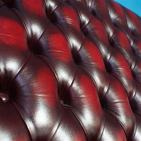 This handsome three seat sofa has rolled arms, deep diamond tufting and brass nailhead trim. Vintage Oxblood Leather Wingback Chesterfield 3-Seater ...