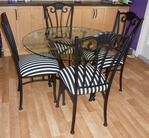 This diy tabletop is a genius idea for those who have kids! DIY total $67. Wrought iron bare chairs and table base was Free on Kijiji. Upholstered the ...