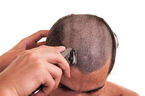 As a lot of hair has been swept over, it makes the bangs really stand out. Man Having A Haircut With Hair Clippers Over A White ...