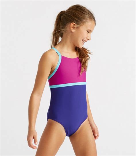 Sun surf primarily reproduces the rayon hawaiian shirts of their golden age from the 1930's to the 1950's. Girls' Sun-and-Surf Reversible Swimsuit, One-Piece