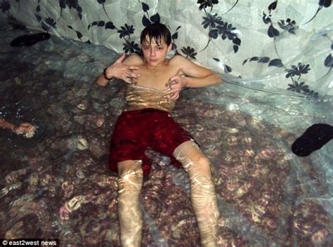 Two young boys catch her attention, and she makes a. Ukrainian teenagers turn living room into a swimming pool by filling it with water | Daily Mail ...