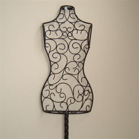 Maybe you would like to learn more about one of these? black metal dress form