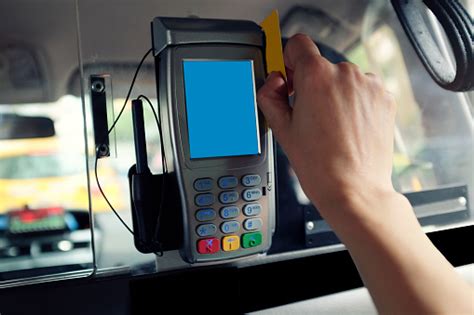 By choosing online payments, you can avoid handling cash and skip queues and third party points altogether. Womans Hand Swiping Credit Card On Taxi Cab Stock Photo ...