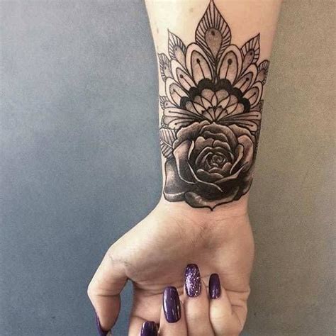 Black flower black has a power to cover up everything. 10 Stylish Wrist Tattoo Ideas for Women: #6. FLORAL ...