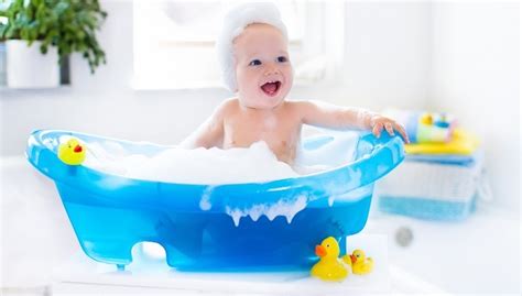 Bath toys or books can help baby enjoy bathtime, but use caution with bubbles, since frequent bubble baths can dry out baby's skin. Steps to Make Baby Bath Time Easier