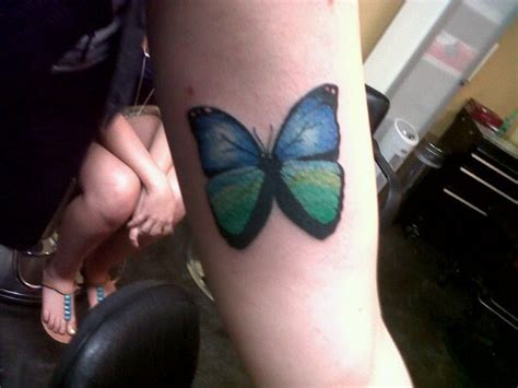 Fake and real butterfly tattoos. Through the Looking Glass