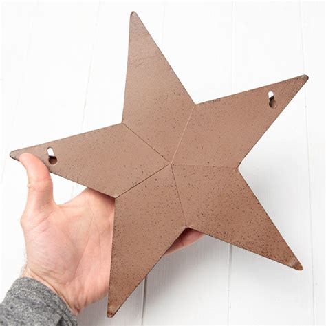 It simply captures the attention of any one who sees it. 12" Rustic Barn Star Wall Pocket - Barn Stars - Primitive Decor - Factory Direct Craft