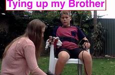 brother little tying sibling