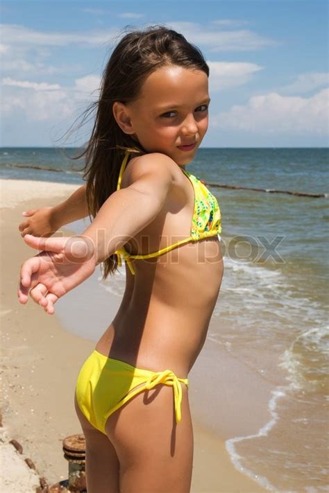 Harv, pen behind justin bieber's 'peaches', revels in his first no. Little girl posing at the seaside | Stock image | Colourbox