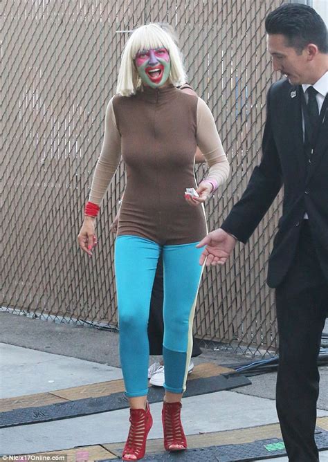 Watch i'd love to cover her face with a hot load! Sia Furler covers her face in paint as she arrives to ...